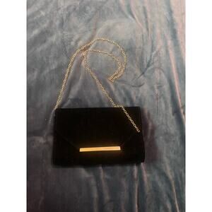Simple black clutch with gold chain